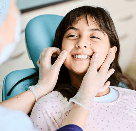 Dentist checking a child's smile.
